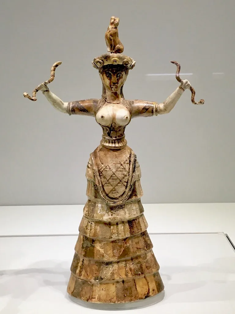 Minoan snake goddess. In the Archaeological Museum in Hera ...